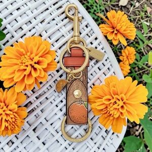 New! COACH Orange Print Trigger Snap Bag Charm Signature Canvas (NWT)